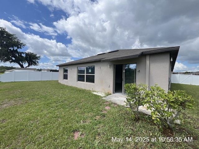 3188 Nubbin Ridge Ln, Zephyrhills, FL 33540 - back of property with stucco siding