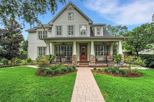 1825 Pawnee Trl, Lakeland, FL 33803 - view of front of home featuring ceiling fan, a front yard, and a porch