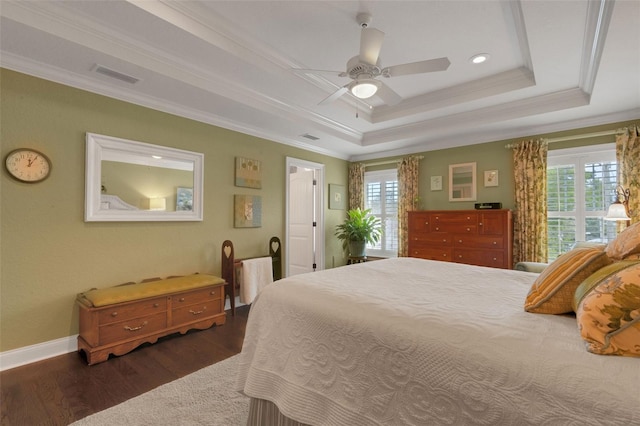 1825 Pawnee Trl, Lakeland, FL 33803 - bedroom with crown molding, wood finished floors, a raised ceiling, baseboards, and a ceiling fan