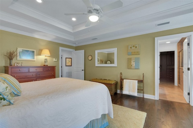 1825 Pawnee Trl, Lakeland, FL 33803 - bedroom featuring crown molding, dark wood-type flooring, recessed lighting, baseboards, and a raised ceiling