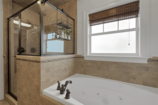 1825 Pawnee Trl, Lakeland, FL 33803 - bathroom featuring a shower stall and a tub with jets