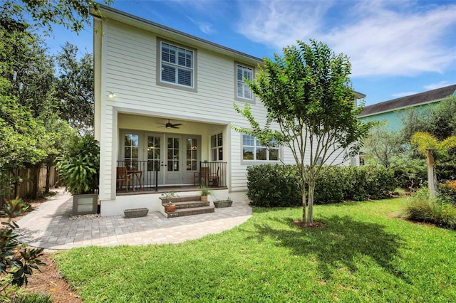 1825 Pawnee Trl, Lakeland, FL 33803 - rear view of house with french doors and ceiling fan