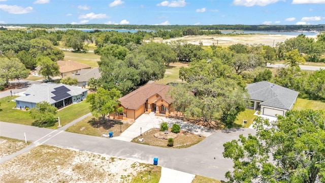 5370 Boxtree Ct, Dade City, FL 33523 - view of subject property with a tree filled landscape and a nearby body of water