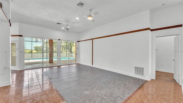 5370 Boxtree Ct, Dade City, FL 33523 - spare room featuring ceiling fan, a textured ceiling, baseboards, tile patterned flooring, and recessed lighting