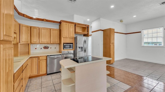 5370 Boxtree Ct, Dade City, FL 33523 - kitchen with open shelves, stainless steel appliances, recessed lighting, light countertops, and backsplash