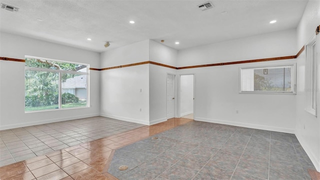 5370 Boxtree Ct, Dade City, FL 33523 - spare room featuring tile patterned flooring, recessed lighting, and baseboards