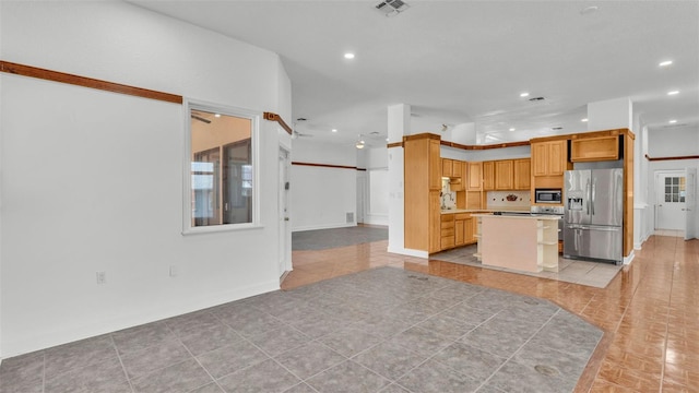 5370 Boxtree Ct, Dade City, FL 33523 - kitchen with appliances with stainless steel finishes, recessed lighting, open floor plan, light countertops, and a center island