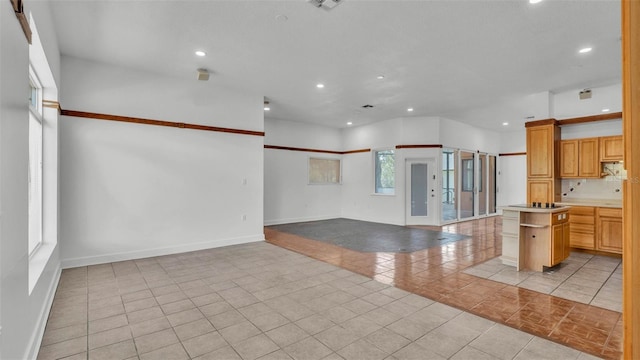 5370 Boxtree Ct, Dade City, FL 33523 - kitchen with open shelves, recessed lighting, light tile patterned floors, baseboards, and open floor plan