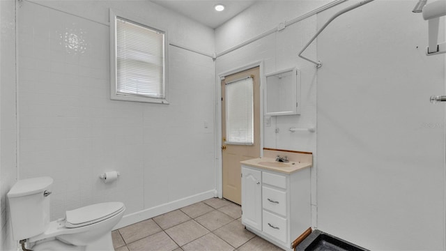 5370 Boxtree Ct, Dade City, FL 33523 - bathroom with toilet, vanity, and tile patterned flooring