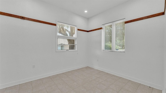 5370 Boxtree Ct, Dade City, FL 33523 - spare room featuring baseboards and recessed lighting