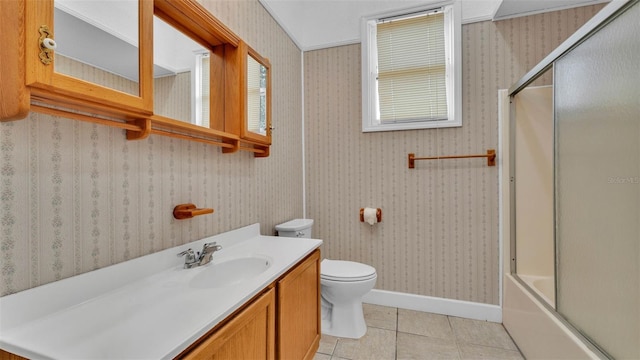5370 Boxtree Ct, Dade City, FL 33523 - bathroom with toilet, vanity, tile patterned flooring, bath / shower combo with glass door, and baseboards