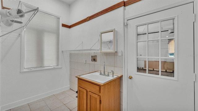 5370 Boxtree Ct, Dade City, FL 33523 - bathroom with vanity, baseboards, tile patterned flooring, and decorative backsplash