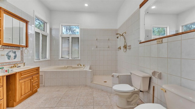 5370 Boxtree Ct, Dade City, FL 33523 - full bath with toilet, tile walls, plenty of natural light, tile patterned floors, and tiled shower