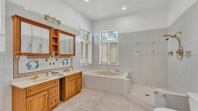 5370 Boxtree Ct, Dade City, FL 33523 - bathroom featuring a garden tub, double vanity, tile patterned flooring, a tile shower, and toilet