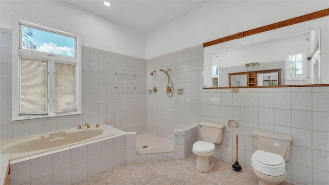 5370 Boxtree Ct, Dade City, FL 33523 - bathroom featuring toilet, tile patterned floors, tile walls, a tile shower, and a garden tub
