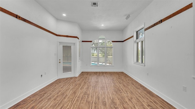 5370 Boxtree Ct, Dade City, FL 33523 - spare room featuring wood finished floors, baseboards, and recessed lighting