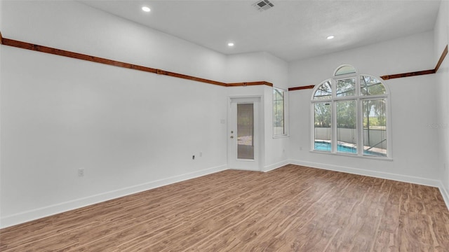 5370 Boxtree Ct, Dade City, FL 33523 - unfurnished room with wood finished floors, baseboards, and recessed lighting