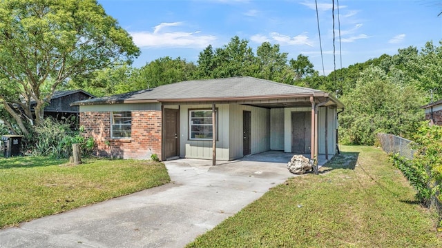 1017 Fleming Ave, Lakeland, FL 33815 - view of front of property featuring driveway, brick siding, and an attached carport