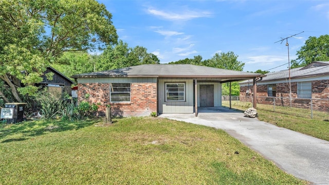 1017 Fleming Ave, Lakeland, FL 33815 - ranch-style home featuring driveway, brick siding, and a carport