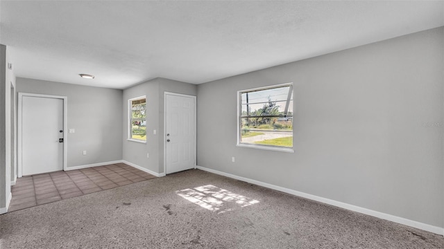 1017 Fleming Ave, Lakeland, FL 33815 - entrance foyer featuring carpet floors and baseboards