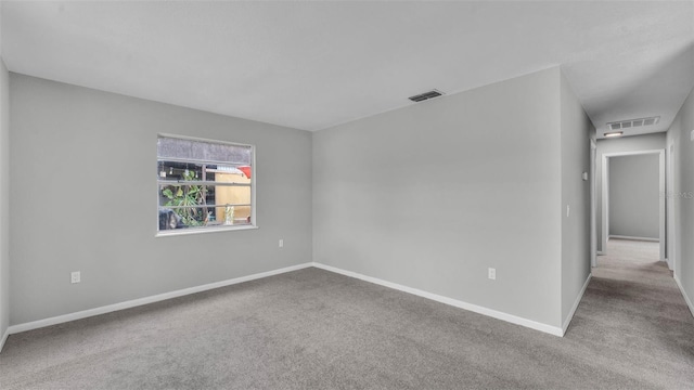 1017 Fleming Ave, Lakeland, FL 33815 - empty room featuring carpet flooring and baseboards