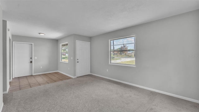 1017 Fleming Ave, Lakeland, FL 33815 - carpeted foyer with baseboards