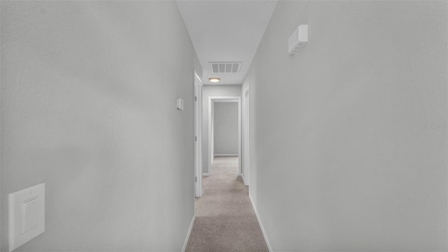1017 Fleming Ave, Lakeland, FL 33815 - hallway with baseboards and light carpet