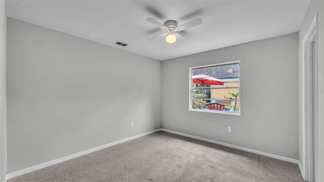 1017 Fleming Ave, Lakeland, FL 33815 - spare room with a ceiling fan, carpet flooring, and baseboards