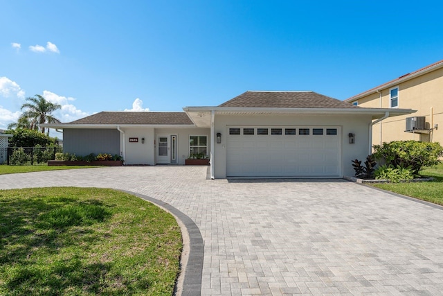 3626 Corsair Ct, New Port Richey, FL 34652 - ranch-style home featuring decorative driveway, a garage, and stucco siding
