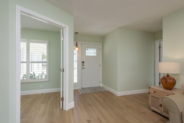 3626 Corsair Ct, New Port Richey, FL 34652 - entryway featuring light wood finished floors and baseboards