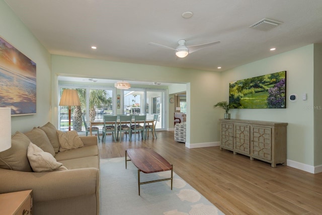 3626 Corsair Ct, New Port Richey, FL 34652 - living room with light wood-style floors, a ceiling fan, baseboards, and recessed lighting