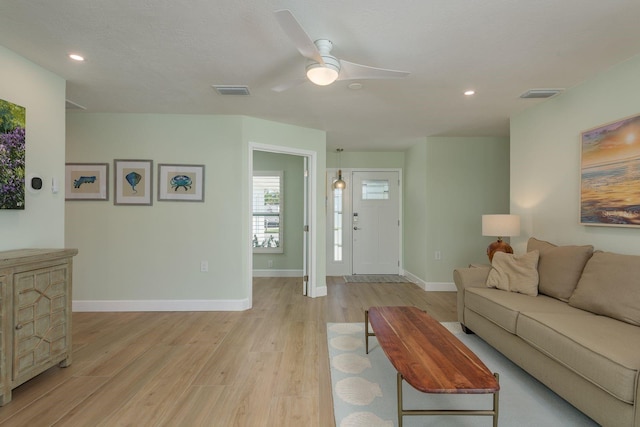 3626 Corsair Ct, New Port Richey, FL 34652 - living room featuring light wood-type flooring, ceiling fan, baseboards, and recessed lighting