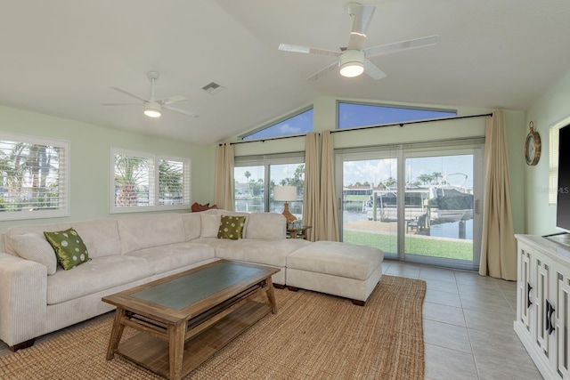 3626 Corsair Ct, New Port Richey, FL 34652 - living room with ceiling fan, vaulted ceiling, and light tile patterned flooring
