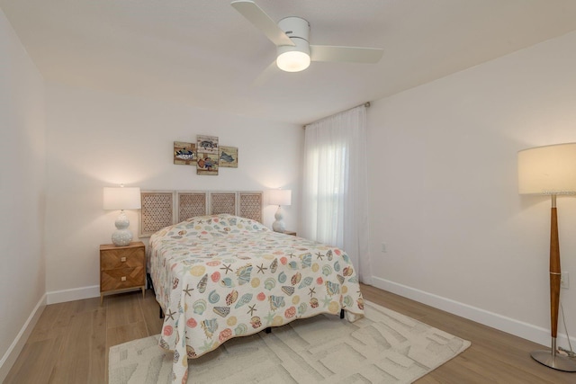 3626 Corsair Ct, New Port Richey, FL 34652 - bedroom featuring wood finished floors, baseboards, and ceiling fan