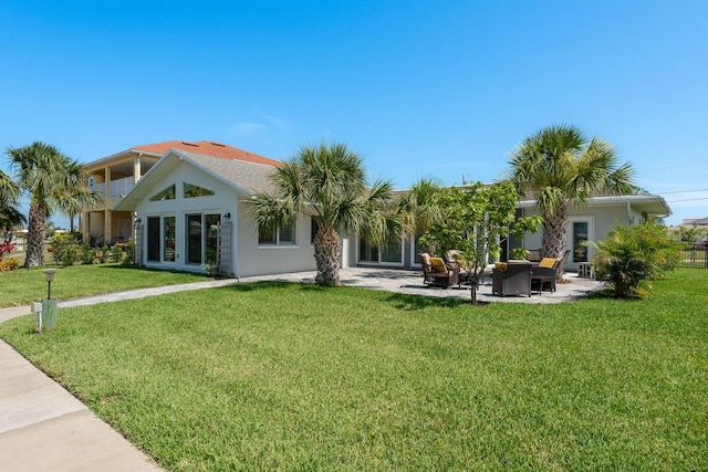 3626 Corsair Ct, New Port Richey, FL 34652 - back of house with a yard, a patio, stucco siding, and french doors
