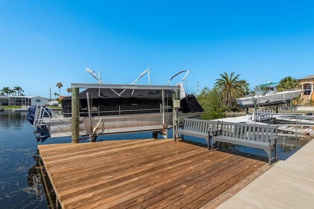 3626 Corsair Ct, New Port Richey, FL 34652 - dock area with boat lift and a water view