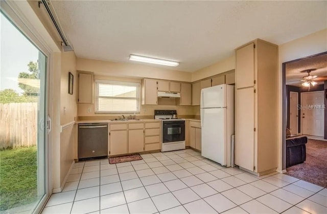 1410 Bramblewood Dr, Lakeland, FL 33811 - kitchen with stainless steel dishwasher, range with electric stovetop, freestanding refrigerator, under cabinet range hood, and a sink