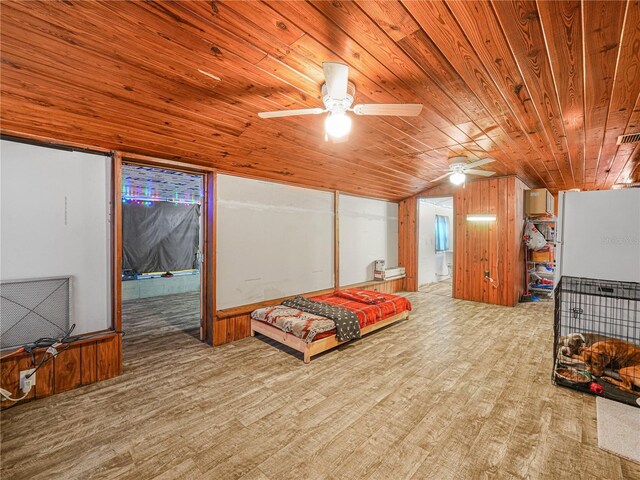 2120 Dille St, Lakeland, FL 33815 - bedroom featuring wood ceiling, wood finished floors, wood walls, and lofted ceiling