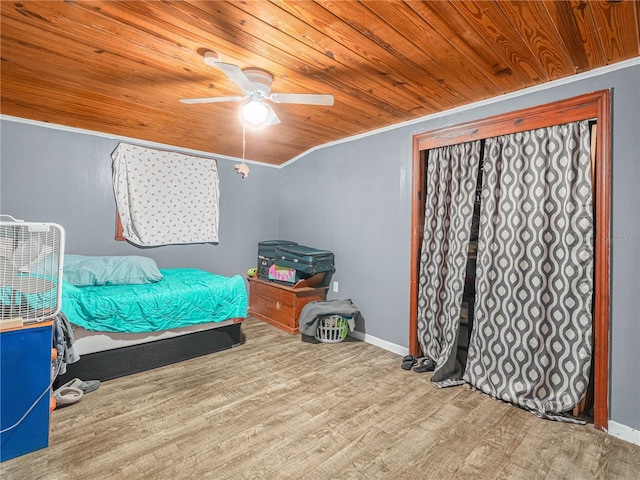 2120 Dille St, Lakeland, FL 33815 - bedroom featuring wood finished floors, wood ceiling, baseboards, ceiling fan, and ornamental molding