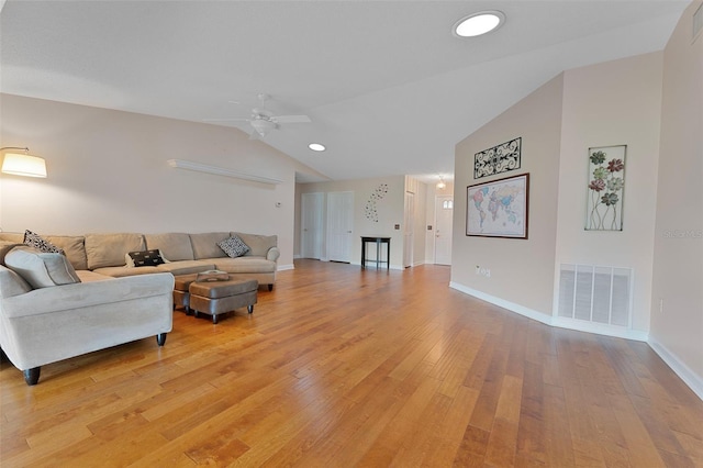 3487 Highland Fairways Blvd, Lakeland, FL 33810 - living room featuring vaulted ceiling, a ceiling fan, light wood-style flooring, and baseboards