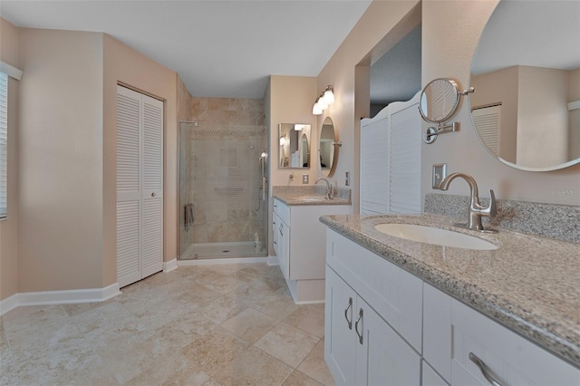 3487 Highland Fairways Blvd, Lakeland, FL 33810 - full bathroom featuring a closet, a shower stall, two vanities, and baseboards