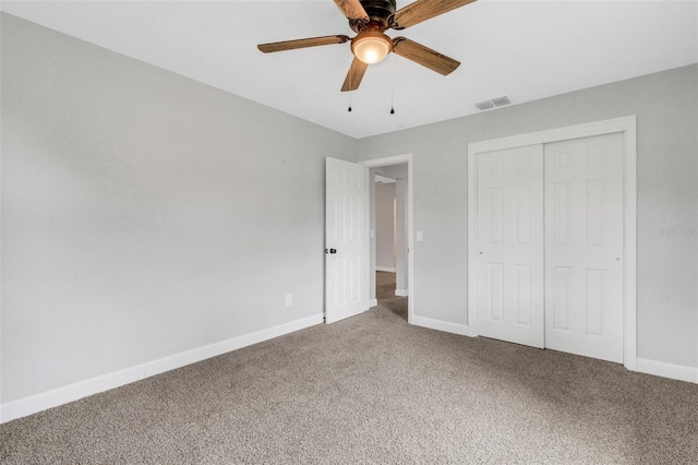 3601 Ave R NW, Winter Haven, FL 33881 - unfurnished bedroom with carpet, baseboards, a closet, and a ceiling fan
