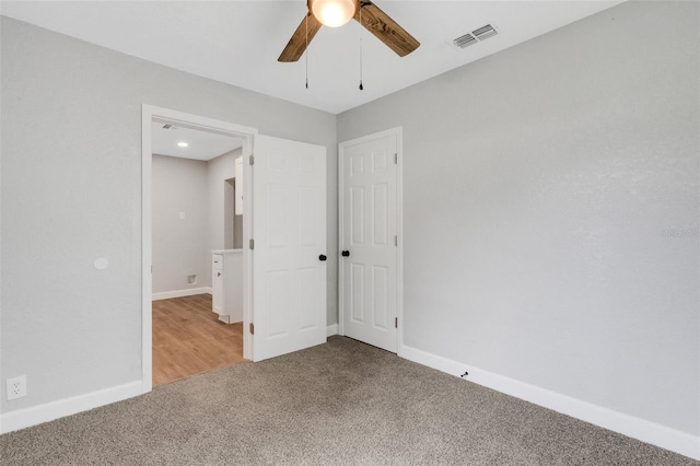 3601 Ave R NW, Winter Haven, FL 33881 - unfurnished bedroom with carpet flooring, baseboards, and a ceiling fan