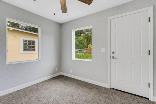 3601 Ave R NW, Winter Haven, FL 33881 - empty room featuring a ceiling fan, carpet floors, and baseboards