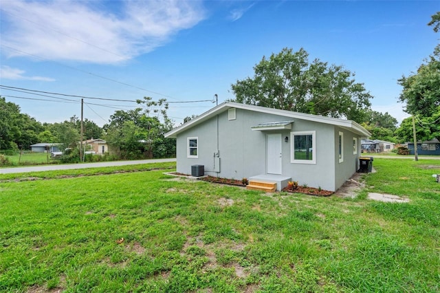 3601 Ave R NW, Winter Haven, FL 33881 - view of home's exterior featuring a yard and cooling unit