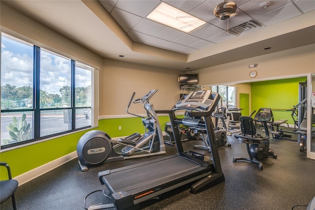 5933 Cormorant Ct, Lakeland, FL 33809 - gym with baseboards and a raised ceiling