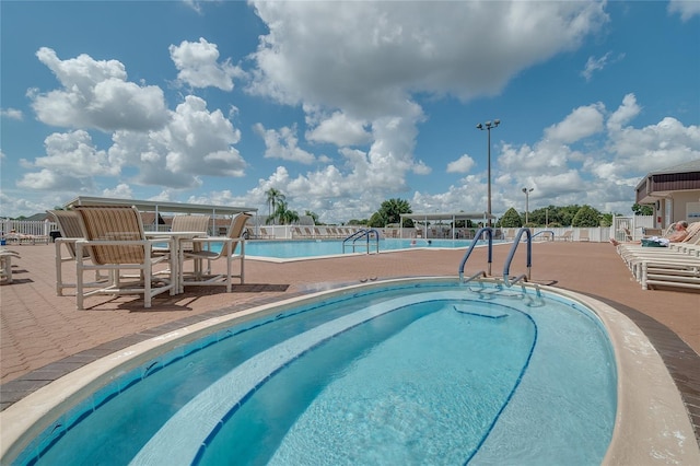 5933 Cormorant Ct, Lakeland, FL 33809 - community pool featuring a patio