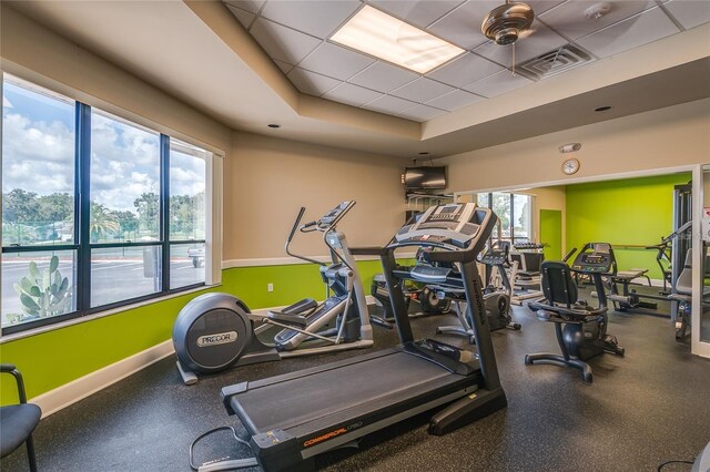 5927 Cormorant Ct, Lakeland, FL 33809 - gym with baseboards and a raised ceiling