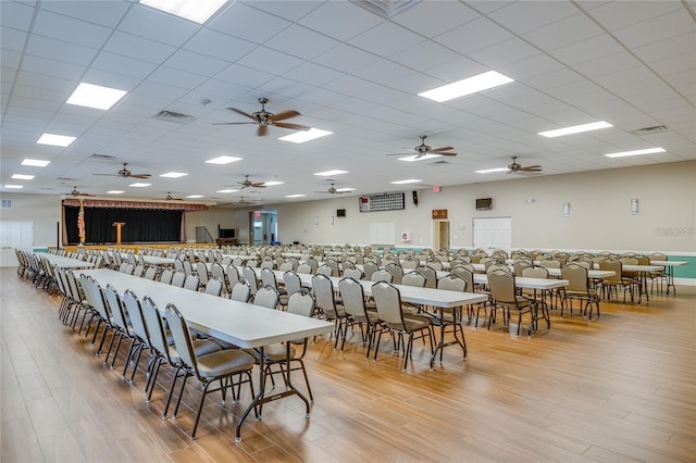 5927 Cormorant Ct, Lakeland, FL 33809 - dining area with light wood-type flooring, a ceiling fan, and a paneled ceiling