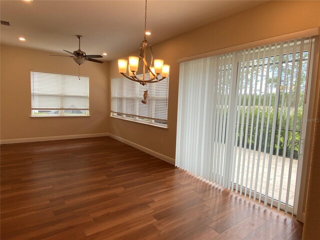 1167 Motorcoach Dr, Polk City, FL 33868 - unfurnished room with wood finished floors, healthy amount of natural light, baseboards, a chandelier, and recessed lighting